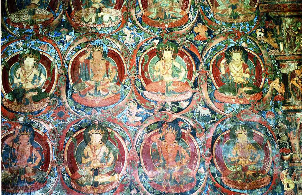 Tibet Guge 03 Tholing 04 Red Temple Many Images Along the left hand wall are floor-to-ceiling rows of deities entwined in wreath-like borders each interleaving into a whole organic complex across the entire space. Photo - Th�ni: Westtibet.